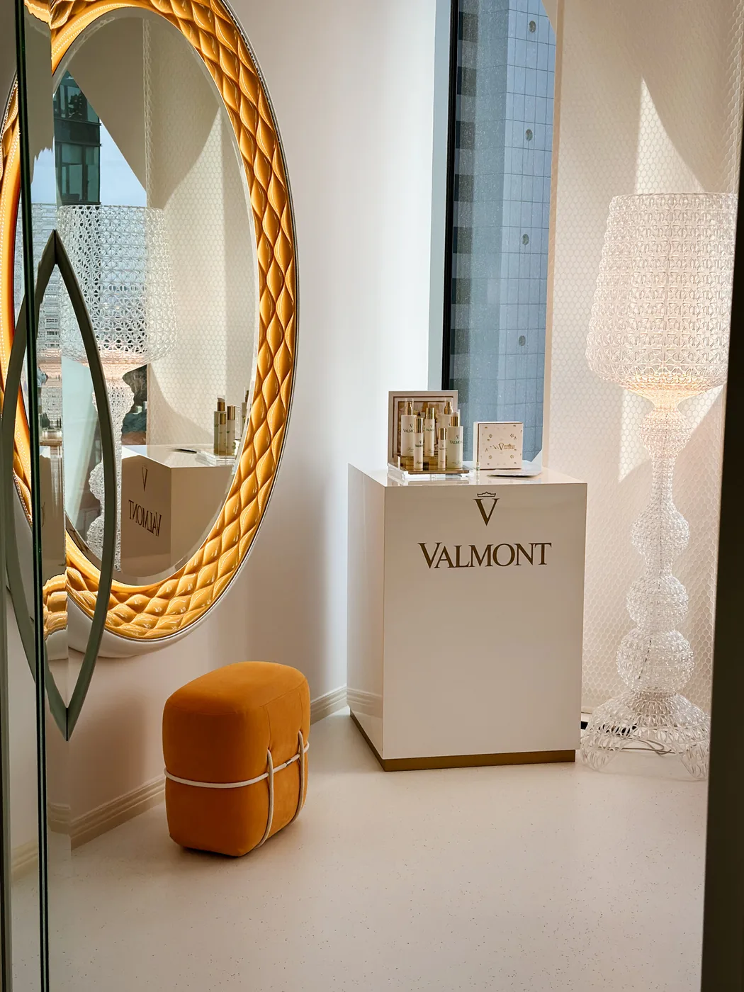 Valmont corner with a gold-framed mirror